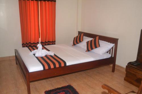 Postel nebo postele na pokoji v ubytování Hotel Thilon