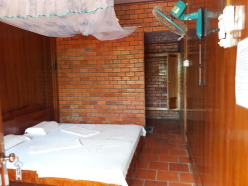 Ένα ή περισσότερα κρεβάτια σε δωμάτιο στο Ba Linh Homestay