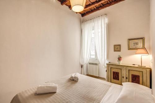 Posteľ alebo postele v izbe v ubytovaní GuestHouse o Affittacamere Casa Fienaroli 2
