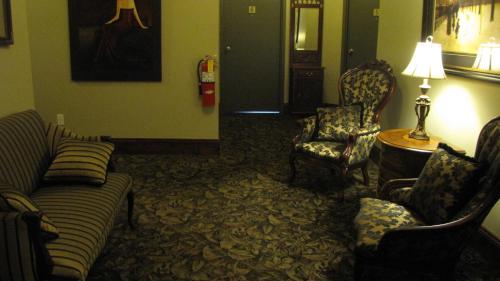 a living room with a couch and two chairs at Spanish Bay Inn, CANADA in Sydney