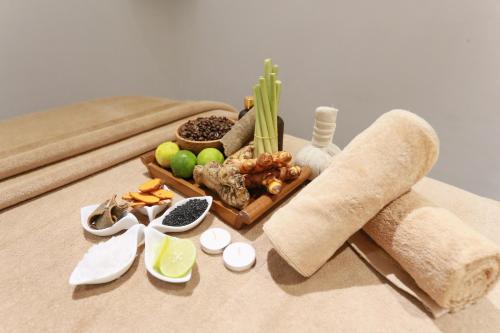 a table with a tray of food on a table at Alba Spa Hotel in Hue