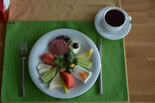 a plate of food on a table with a cup of coffee at ITU Evi Bursa in Bursa
