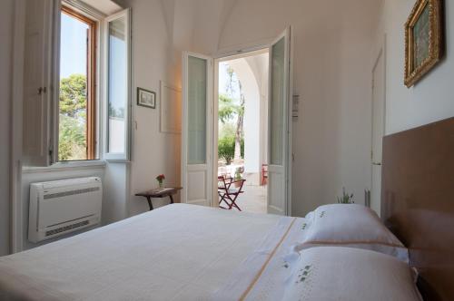En eller flere senge i et værelse på Agriturismo Villa Coluccia