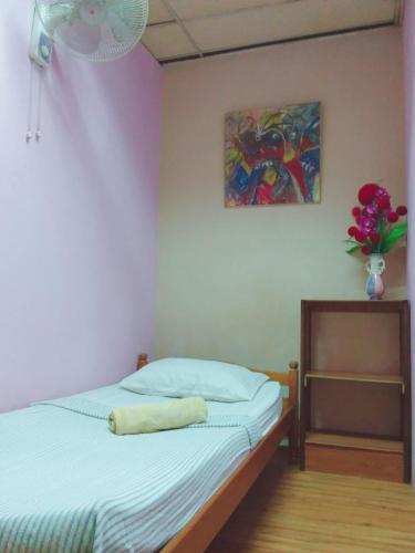 Ένα ή περισσότερα κρεβάτια σε δωμάτιο στο Oasis Guest House