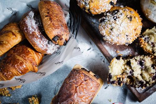 a bunch of different types of pastries on a table at Malmaison Cheltenham in Cheltenham