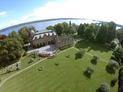 an aerial view of a large house on a green lawn at Engsholms Slott - Adults Only in Mörkö