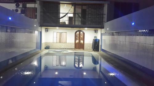 a house with a swimming pool in the middle at Casa con Piscina Privada y Jacuzzi in Flandes