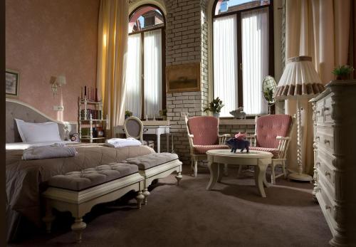 Postel nebo postele na pokoji v ubytování Hotel 19