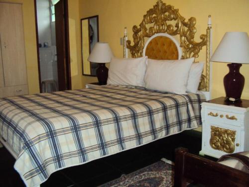 A bed or beds in a room at Hotel Fazenda Sao Sebastiao