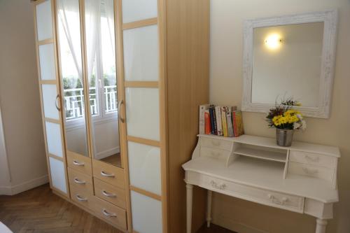 a dressing room with a dresser and a mirror at Plage du Midi in Cannes