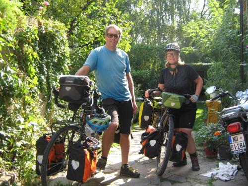 a man and a woman standing next to their bikes at Base for Adventurers - Urban Guerrilla in Negotin