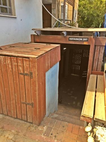 a entrance to a building with a table and a bench at Dotan's Boutique Guesthouse - By The Beach! in Tel Aviv