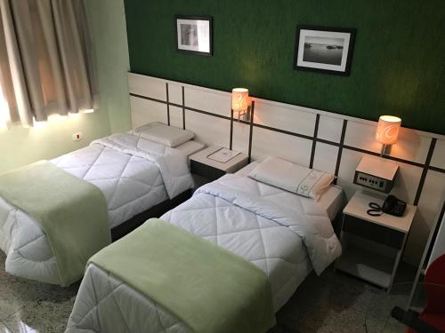 Cama ou camas em um quarto em Residencial Pantanal Santa Cruz
