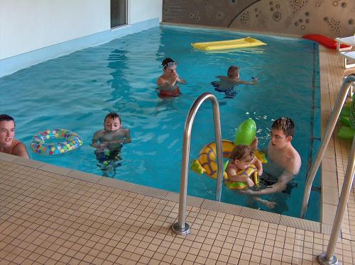a group of people in a swimming pool at Landhotel Henkenhof Willingen in Willingen