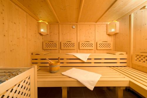 a wooden sauna with a table in the middle at Frühstückspension Astoria in Sölden