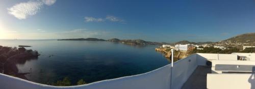 a view of a large body of water from a balcony at Nostos Studios in Parikia
