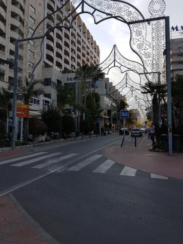 an empty city street with buildings in the background at Apartamento bahia park 1a linea " Magic world " in Oropesa del Mar