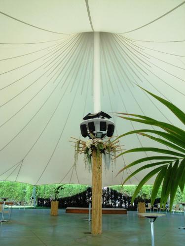 a large white tent with a table in it at Hotel Brujas De Irues in Tarazona de Aragón