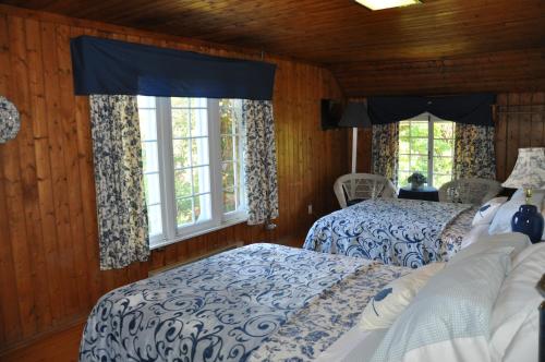 Postel nebo postele na pokoji v ubytování Auberge sur la Côte