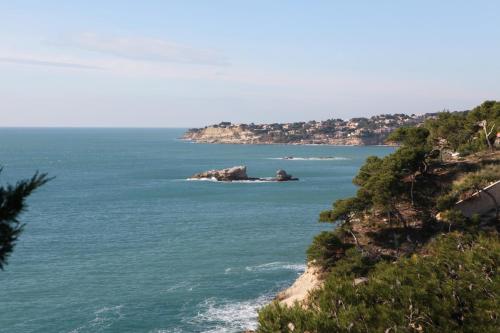an island in the middle of a body of water at Hotel La Tuiliere in Carry-le-Rouet