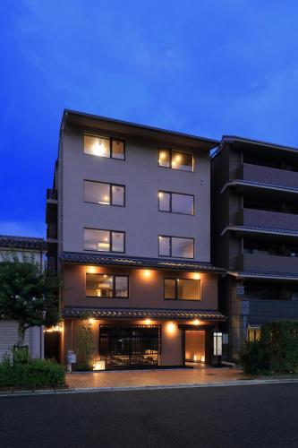 a large building with lights on the side of it at Hotel Kuu Kyoto in Kyoto