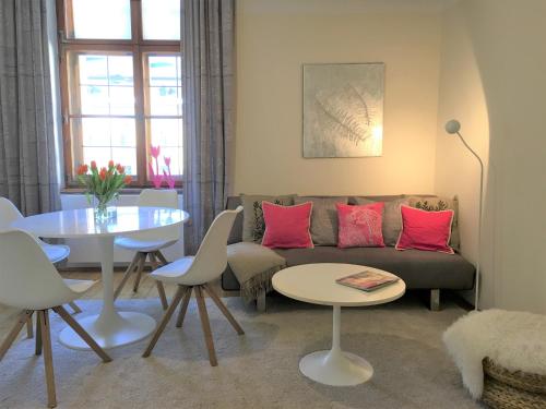 a living room with a couch and a table at Wohnung Schloss Mondsee in Mondsee