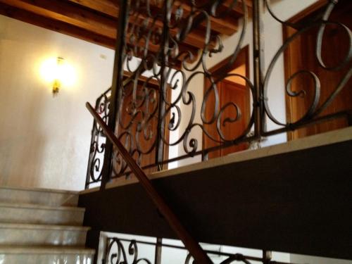 a set of stairs with a wrought iron railing at Ca'Nova Alloggi in Campalto
