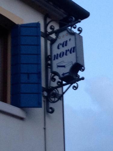 a sign on the side of a building at Ca'Nova Alloggi in Campalto