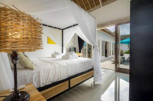 En eller flere senge i et værelse på Villa 3 chambres Angie