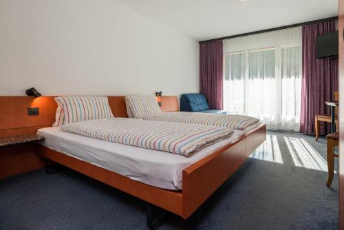 Postel nebo postele na pokoji v ubytování Hotel-Restaurant Ackersand