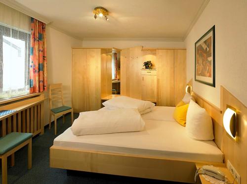 Кровать или кровати в номере Haus Bergkristall