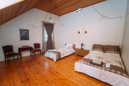 Postel nebo postele na pokoji v ubytování Bolnisi Prime House