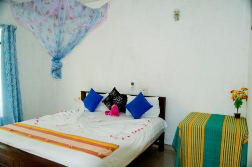 Postel nebo postele na pokoji v ubytování Freedom Home Stay