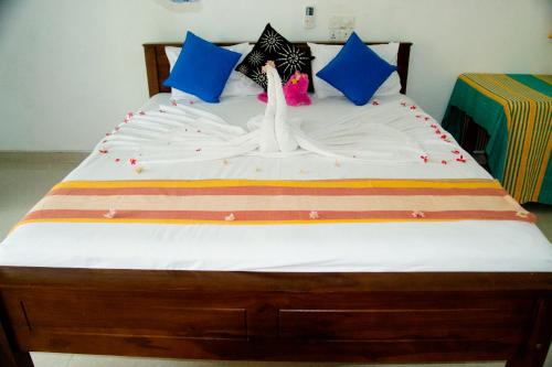 Ένα ή περισσότερα κρεβάτια σε δωμάτιο στο Freedom Home Stay