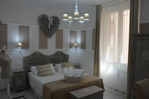 a bedroom with a bed and two hearts on the wall at Ca dei Nobili in Genova