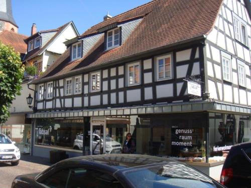 a black and white building on a city street at Malerwinkel & Tuchereck in Michelstadt