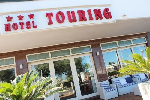 a hotel journey sign on the front of a hotel at Hotel Touring in Misano Adriatico