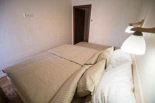 Ένα ή περισσότερα κρεβάτια σε δωμάτιο στο Maria Apartments
