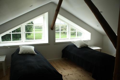 Postel nebo postele na pokoji v ubytování Øvej 18 Holiday House