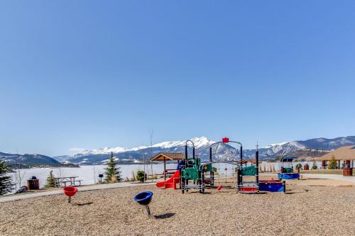 a park with a playground with mountains in the background at Lakeview Marina Place in Dillon