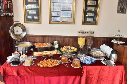 a table with many different types of food on it at San Giovanni Stanly Hotel in Alexandria