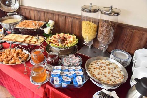 a table topped with lots of different types of food at San Giovanni Stanly Hotel in Alexandria