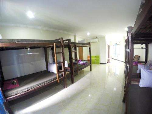 a room with several bunk beds in it at Blue Diamond Hostel in Battambang