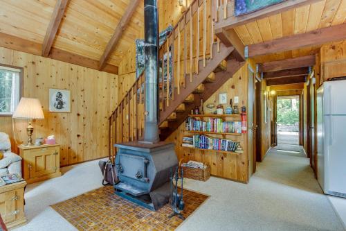 a living room with a woodburning stove in a house at The Chalet on Lopez in Islandale