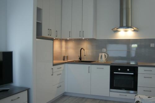 Dapur atau dapur kecil di Q Apartamenty