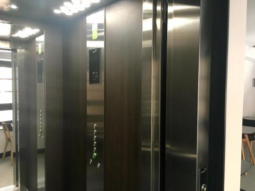 a row of elevators in an office building at MD Design Hotel - Portal del Real in Valencia