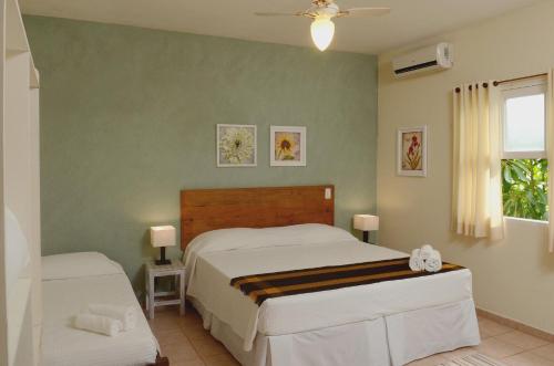 Cama ou camas em um quarto em Pousada Villa Maritima
