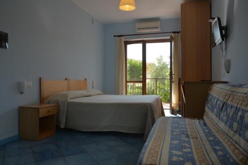 Postel nebo postele na pokoji v ubytování Larus Hotel