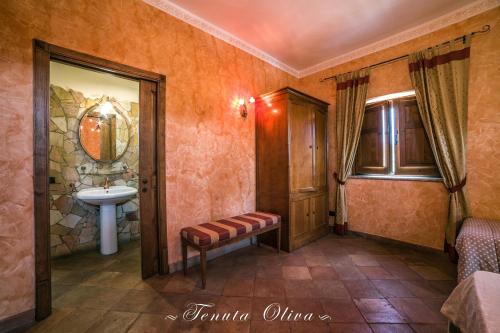 a bathroom with a sink and a toilet at Tenuta Oliva in Fisciano