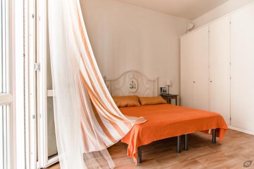 Säng eller sängar i ett rum på Attico con 2 camere in Via Vespucci